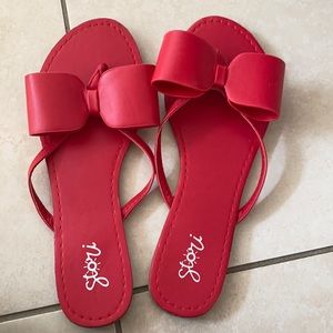 red bowed-thong slides